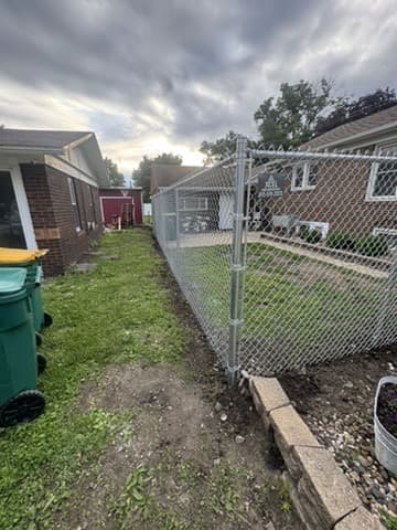 Chain-link fence enclosing a back yard in Streator, Illinois