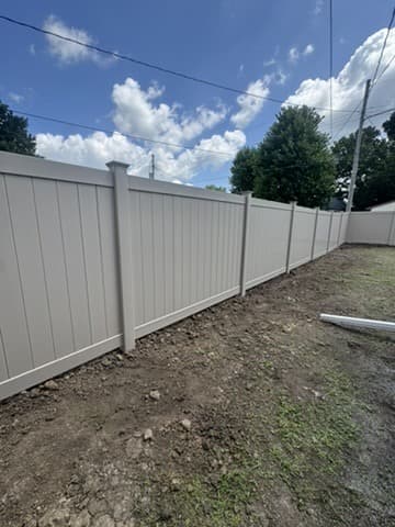 Long white vinyl privacy fence run in Ladd, Illinois