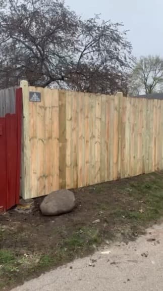 Wood privacy fence panel built board by board on site by Xcel Outdoor Living